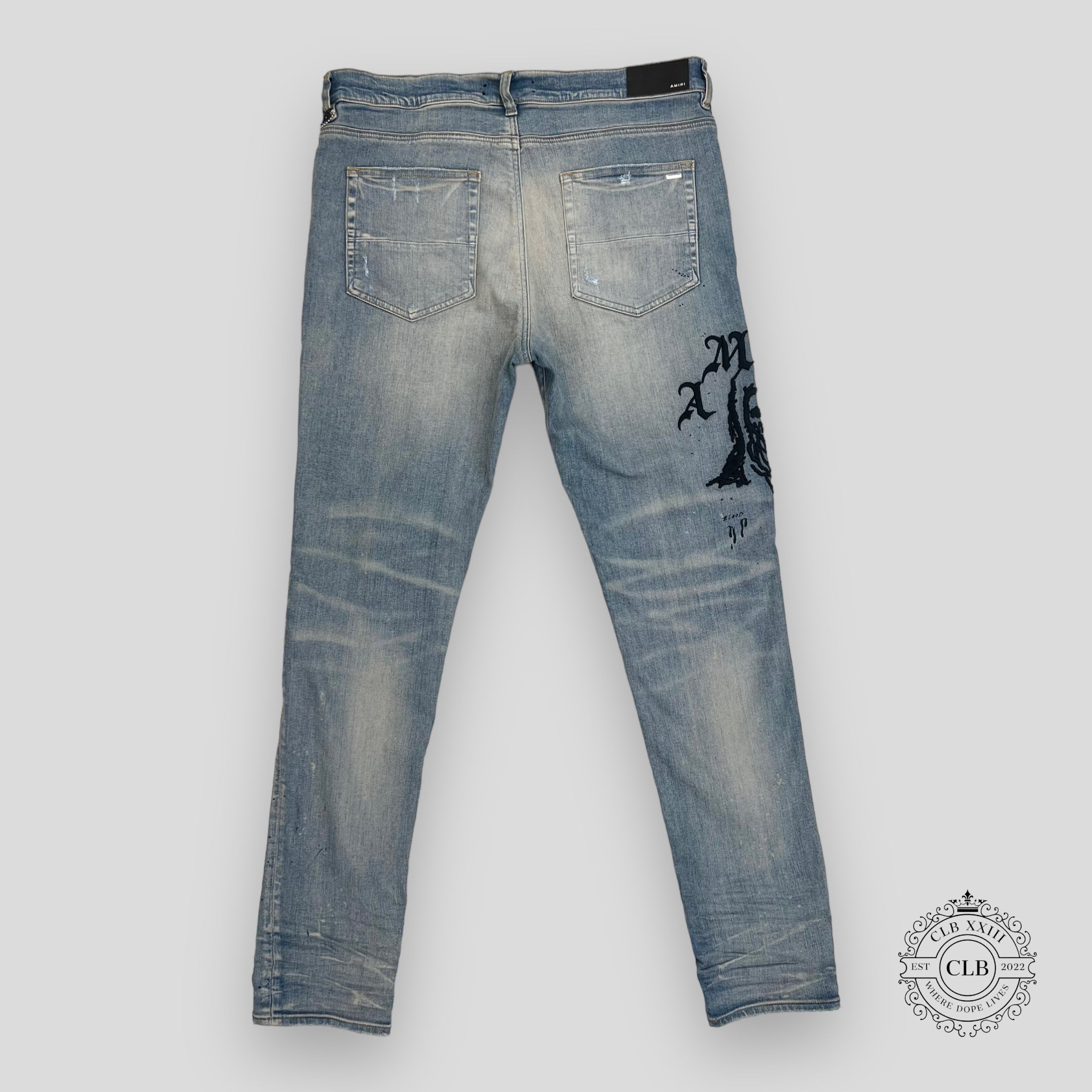 AMIRI X WES LANG REAPER LOGO JEANS - CLAY INDIGO